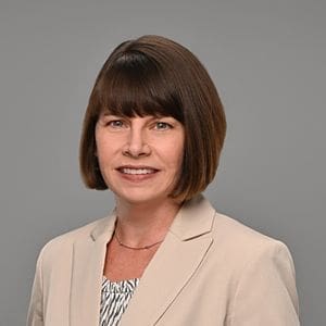 A woman smiling for a headshot