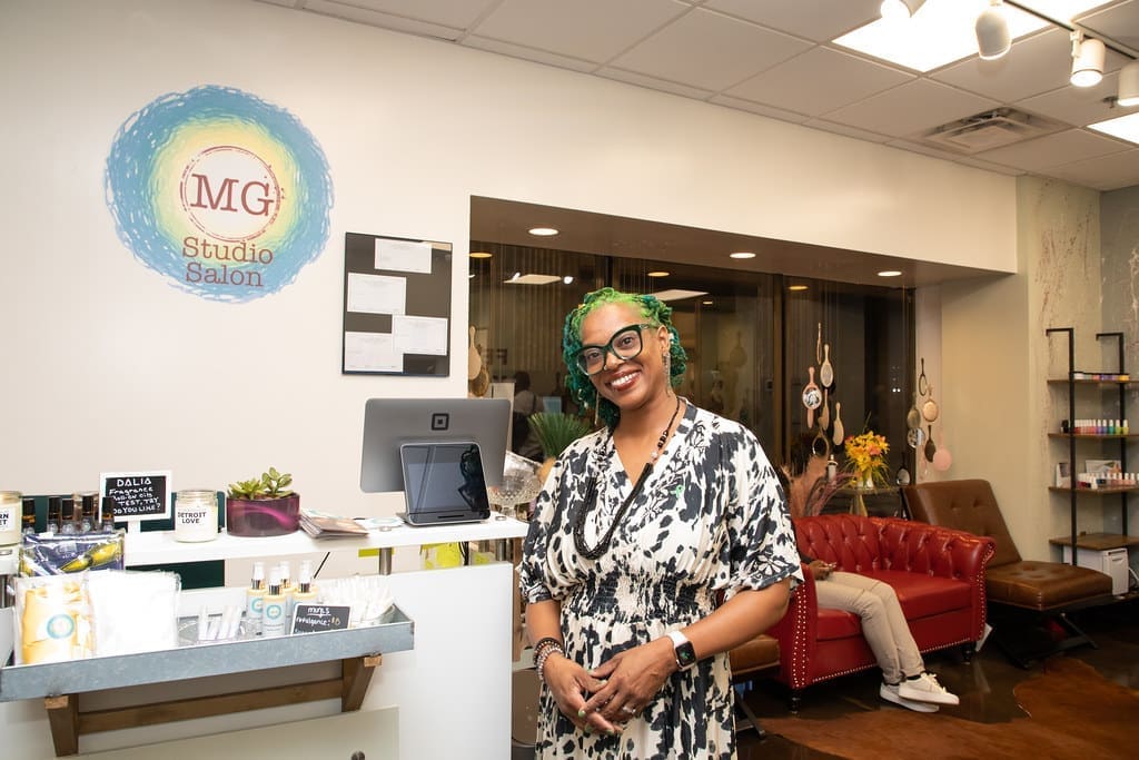Photo of MG Studios owner at grand opening